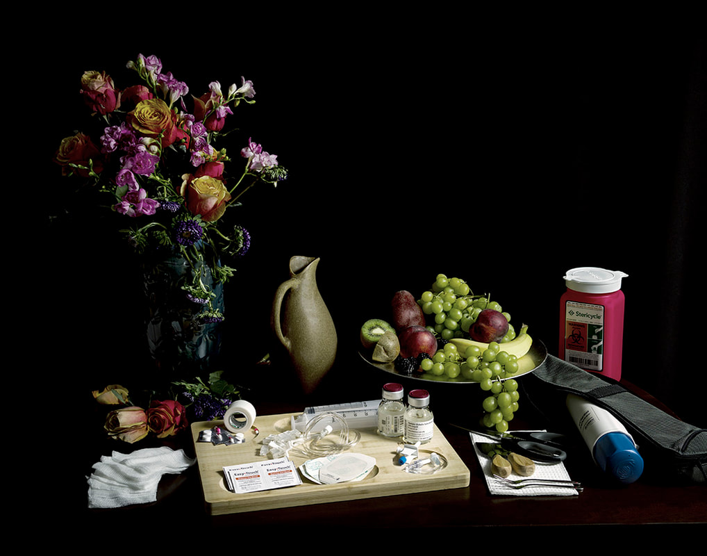 Still life against a black background of a vase of flowers, jug, bowl of fruit, and a cutting board laid out with a series of medications, gauze pads, and medical tools.