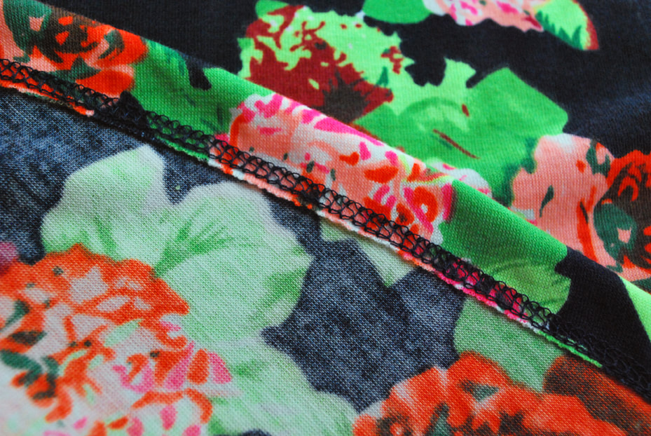 Inside view of a floral knit dress hemmed using a coverstitch.