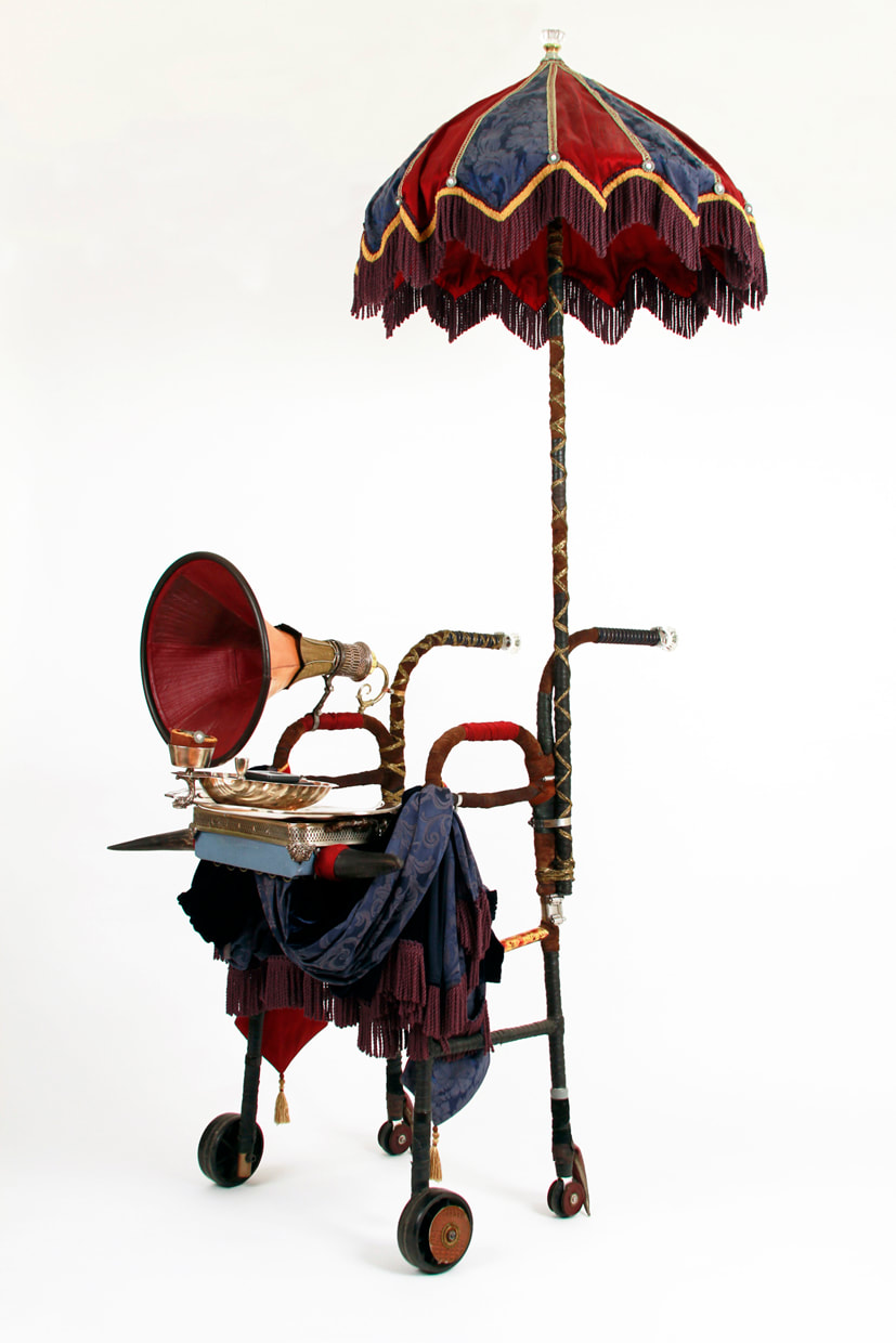 A walker is dressed as a mobile Victorian bathhouse. It has an attached parasol, silver serving platter, compass, GPS unit, and a gramophone horn.