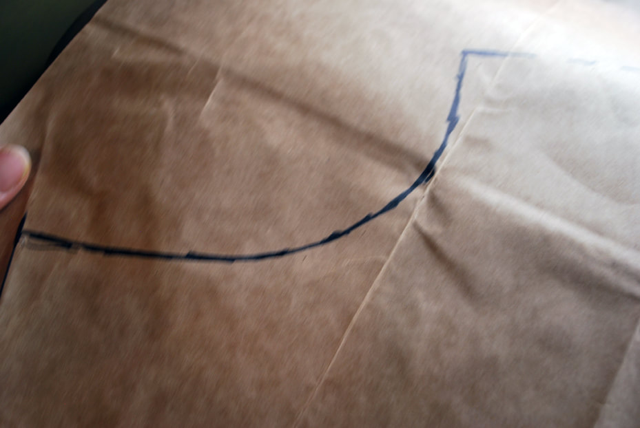 Drawing a smooth armhole curve on the pattern.