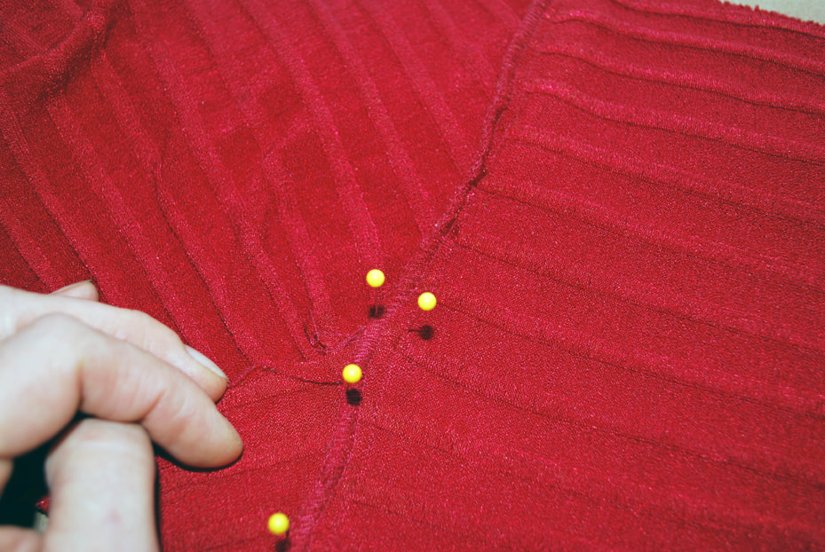 Pinning above and below the overlapped bust seam to mark its place.