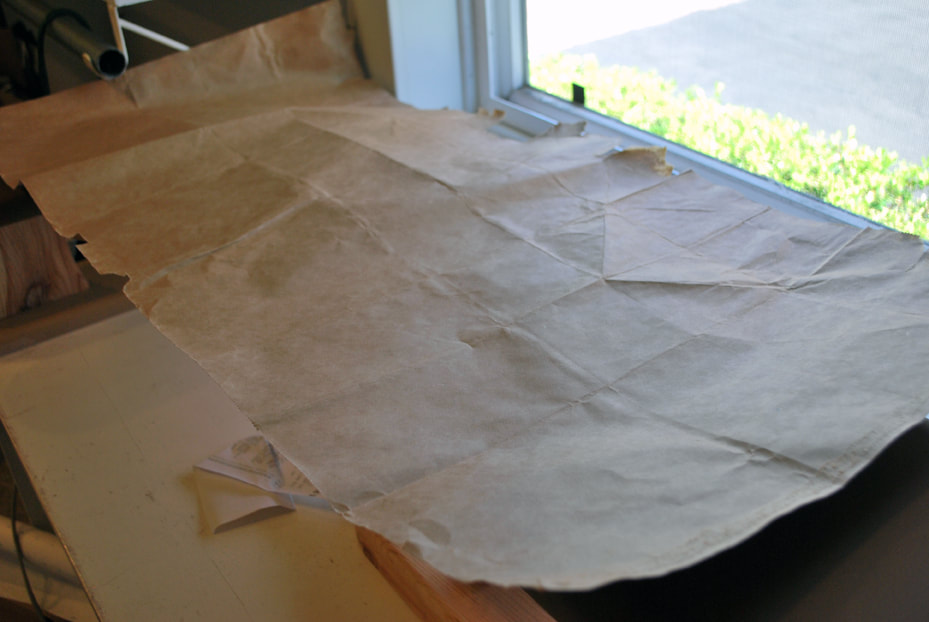 A freshly ironed, flattened-out paper bag that can be used for pattern paper.