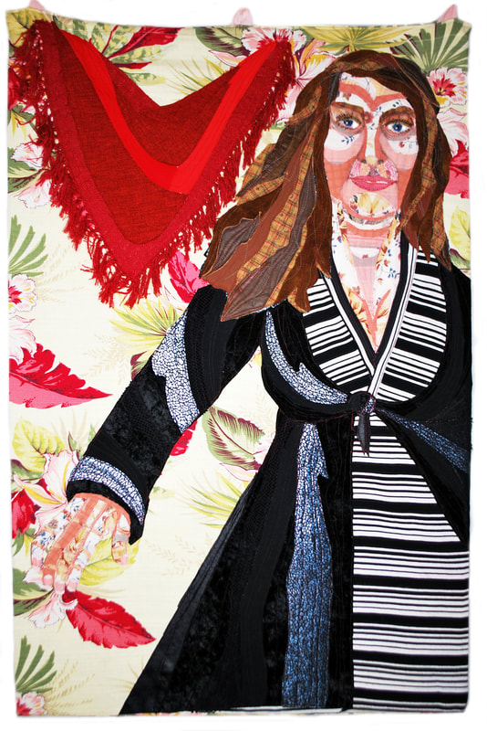 Textile portrait of a woman with brown hair wearing a striped tunic and black overcoat with a red shawl on her left