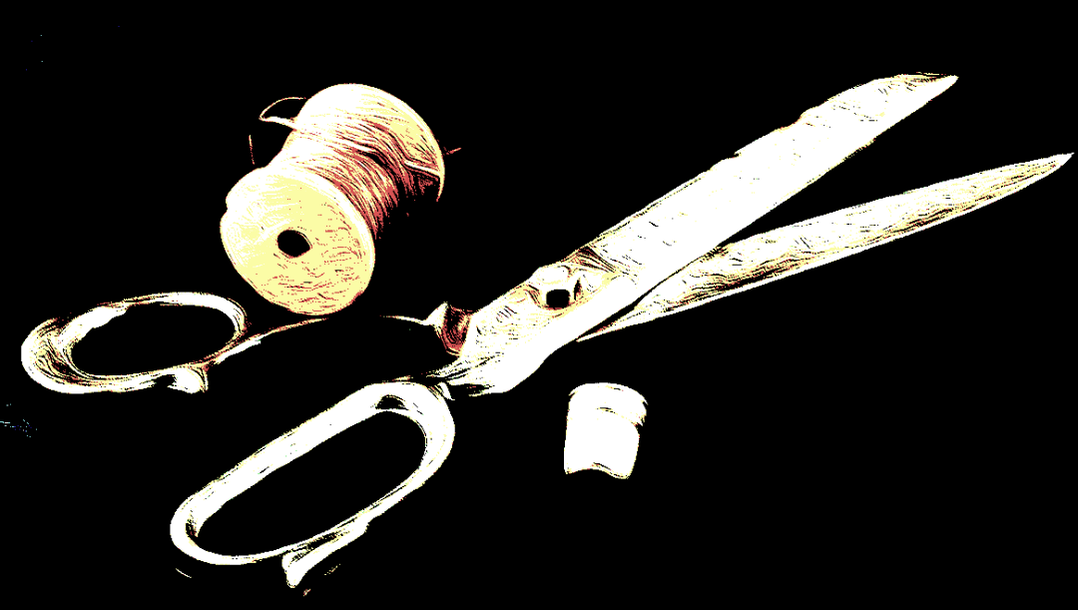 A pair of silver scissors with a thimble and spool of thread against a black background